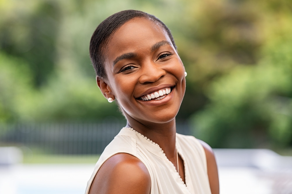 woman smiling.